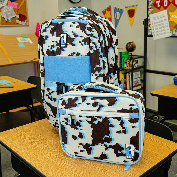 Adult model wearing multi-color lunch box with "Cowhide Curveball SZN 2" design