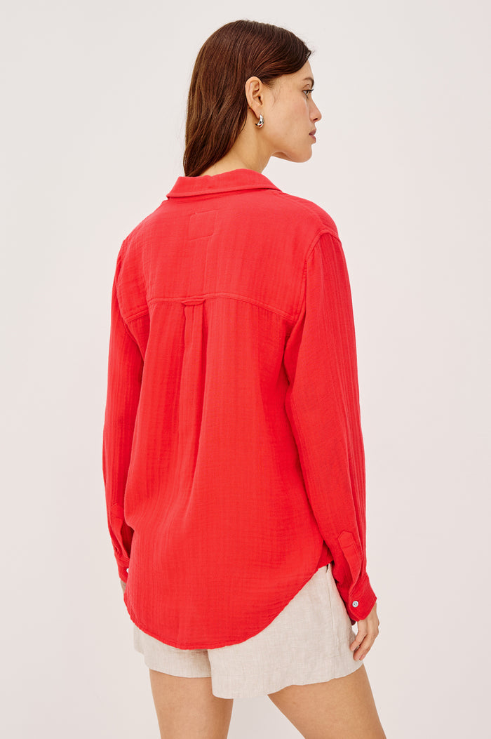 Ellis Relaxed Collared Button Front Shirt with Long Sleeves and a Chest Pocket in cherry red Colorway. Front View Shown on Model.
