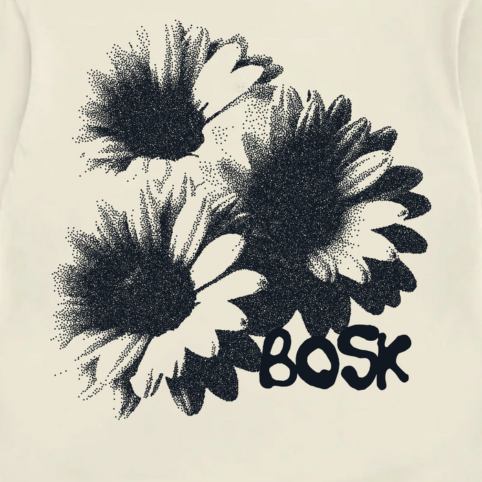 Three black and white daisies with stippled shading are grouped together. Below the flowers, the word “Other” is written in thick, playful, black letters. The design stands out against the plain light background of this men’s off white Floret Tee, crafted from heavyweight cotton for an oversized t-shirt fit.