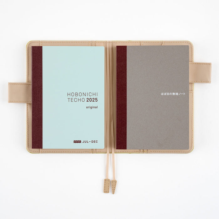 Two A6 notebooks in light brown notebook cover on white background