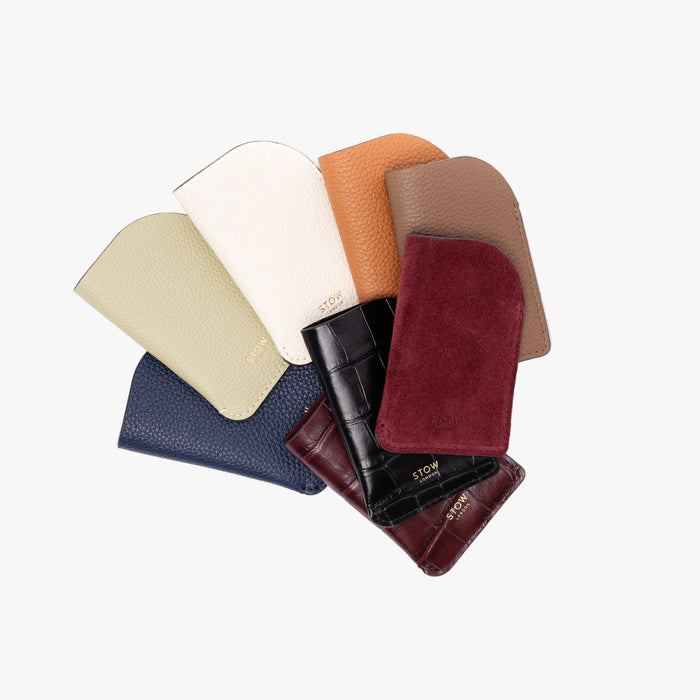 STOW London's Mini Cardholders range on a light grey background featuring a small gold embossed logo on the front bottom