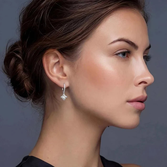 Moissanite Star Halo Dangle Huggie Earrings in silver-toned metal, with sparkling hoops and a geometric star-shaped drop.