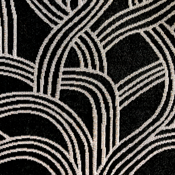 Detailed close-up of pattern inside the Oaklandish tree logo on a black throw blanket.
