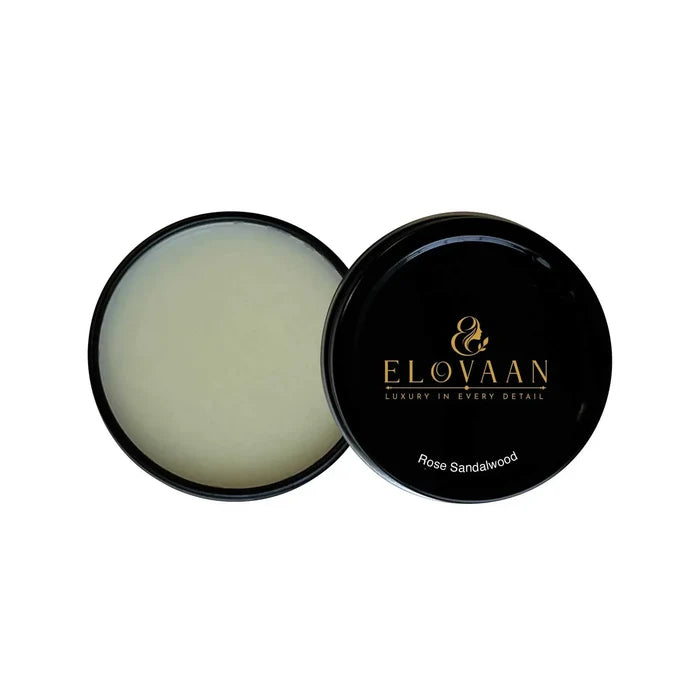 Solid Fragrance in a black round tin, with pale balm exposed and a glossy lid labeled Rose Sandalwood