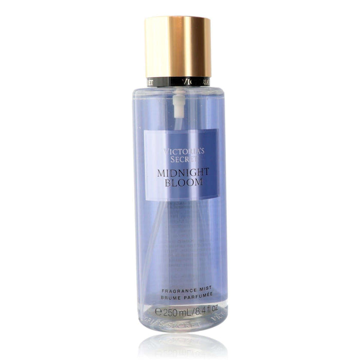 Victoria's Secret Midnight Bloom fragrance mist in a clear lavender-tinted bottle with a gold cap and front label