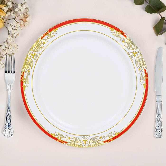 Elegant decorative plate with red and gold floral design, styled with cutlery.