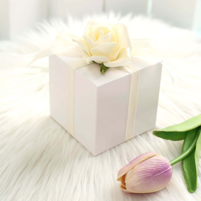 White gift box with a rose decoration on a soft fur background.