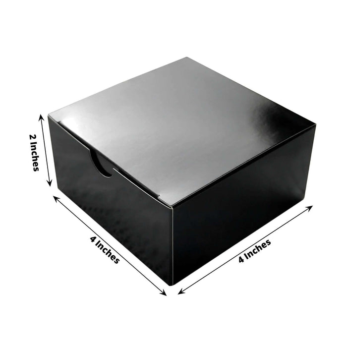 Black storage box, 4x4 inches, 2 inches tall, sleek design.