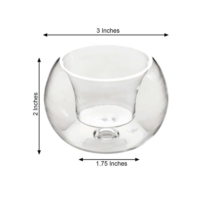 Clear glass candle holder with measurements: 3" W x 2" H x 1.75" D