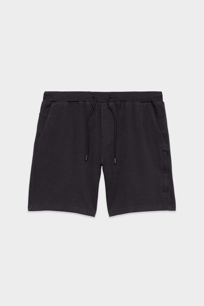 The 686 Mens Everywhere Double Knit Short by 686, featuring an elastic waistband, drawstring ties, and side pockets, is shown laid flat on a light gray background.
