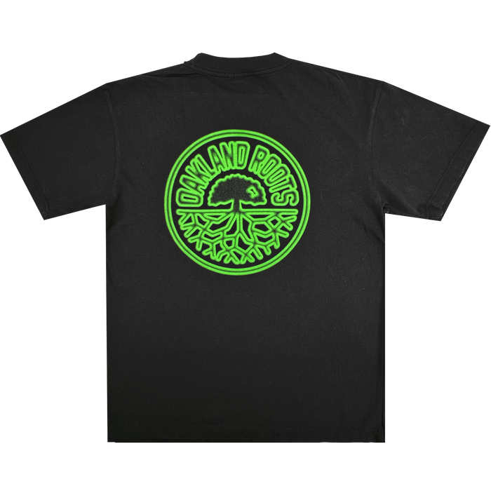 Oakland Roots SC Acid Tee featuring a large, circular neon green oak tree logo with roots and “OAKLAND ROOTS” text on the back, inspired by the club’s signature style.
