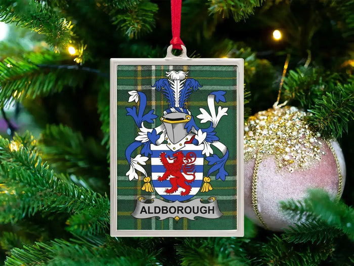 Aldborough Irish family crest Christmas ornament — crest on the Irish national tartan in a silver-tone frame