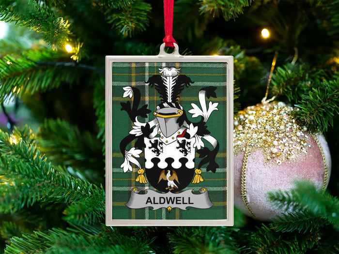 Aldwell Irish family crest Christmas ornament — crest on the Irish national tartan in a silver-tone frame