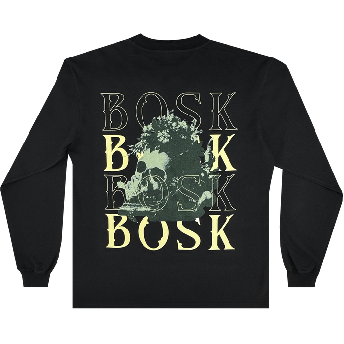 The Allure LS Tee by Other is a black, long-sleeve t-shirt crafted from heavyweight cotton. It features “BOSK” printed four times on the back in yellow and faded white, overlaid with a yellow skull partially obscured by foliage. Designed with a classic fit, this shirt is finished with a crew neck and ribbed cuffs.