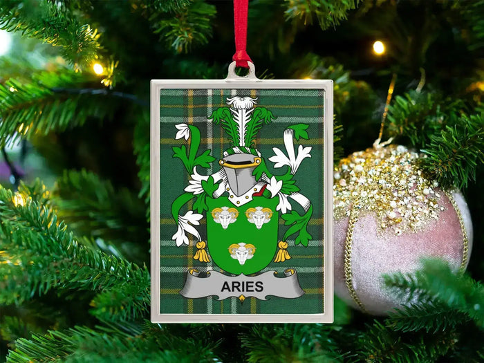 Aries Irish family crest Christmas ornament — crest on the Irish national tartan in a silver-tone frame