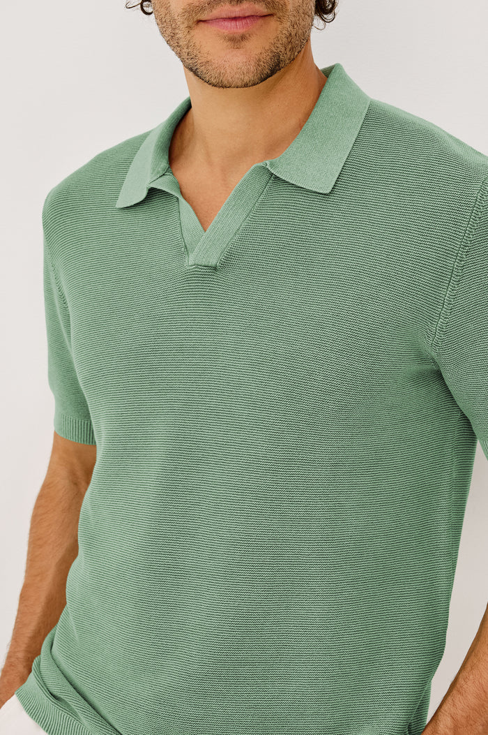 Baker Polo Shirt in Rib Cotton Knit With Colar, Short Sleeves, and Relaxed Fit in Vetiver Colorway - Upper Body Front View Featured on Model