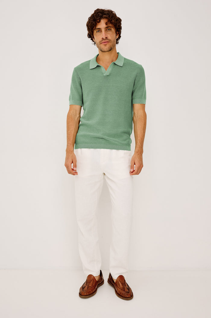 Baker Polo Shirt in Rib Cotton Knit With Colar, Short Sleeves, and Relaxed Fit in Vetiver Colorway - Full Body Front View Featured on Model