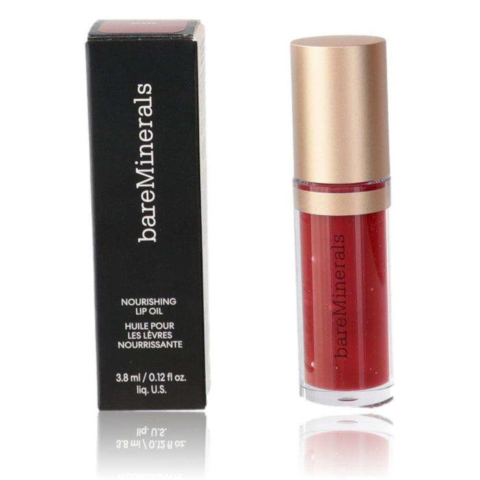 bareMinerals Nourishing Lip Oil in red Spark, housed in a clear tube with a gold cap beside a black box