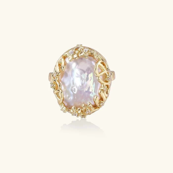 Baroque Freshwater Pearl ring with an iridescent irregular pearl in an ornate gold-tone setting with crystal accents