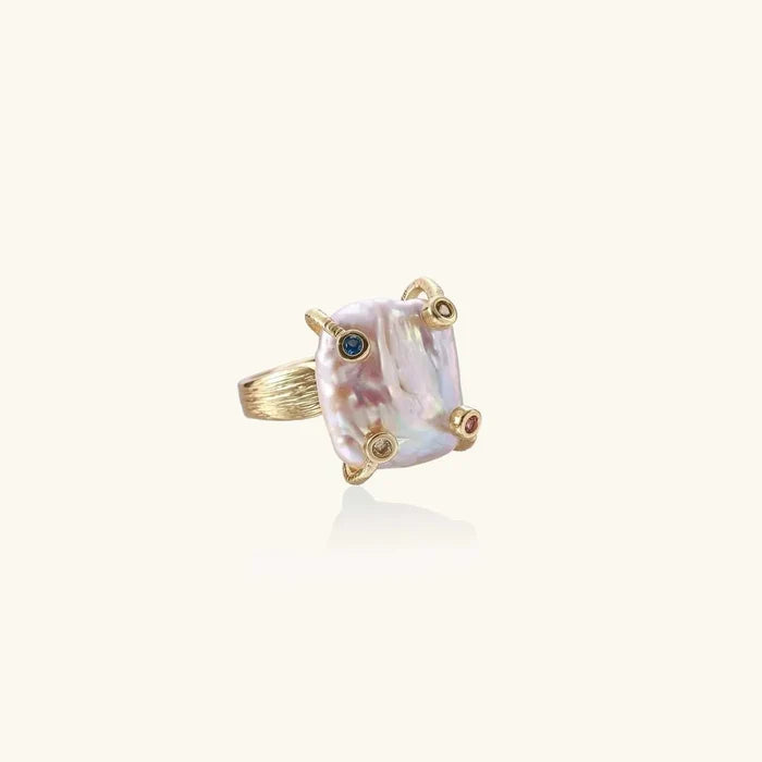 Baroque Freshwater Pearl Statement Ring with an iridescent rectangular pearl, gold-tone textured band and blue, pink and clear accents