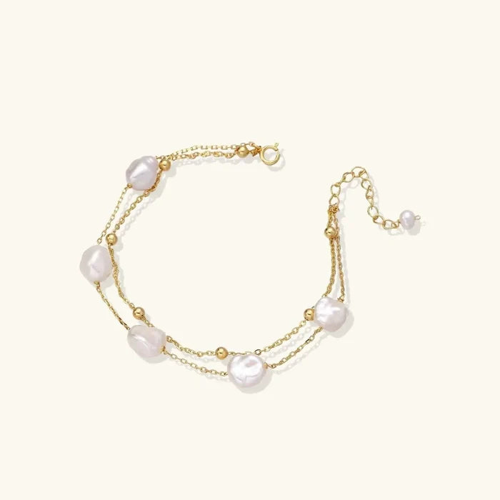 Baroque Pearl Layered Bracelet with two fine gold-tone chains, lustrous irregular white pearls and polished gold beads
