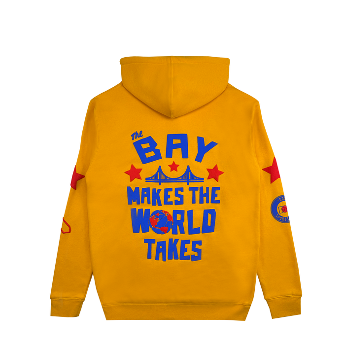 Introducing the Bay Bridge Hoodie by DOC from Other—a vibrant yellow designer hoodie inspired by the creative spirit of the Bay Area. This standout piece features a hood, bold blue “The Bay Makes The World Takes” text across the back, striking red stars, an eye-catching bridge graphic, and a globe that showcases its unique style. Red and blue patches and stars accentuate the sleeves, making this wearable art project truly one-of-a-kind.