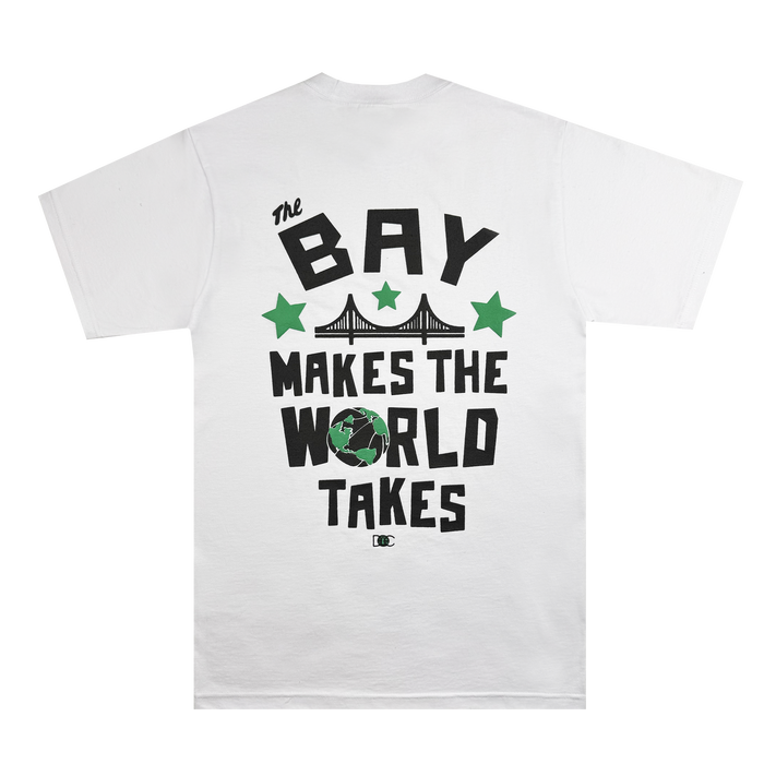 The Bay Bridge Tee by DOC from Other is crafted from heavyweight white cotton and showcases bold black and green lettering: “The BAY MAKES THE WORLD TAKES.” The back features an eye-catching illustration of a bridge, three green stars, and a globe—paying tribute to the energetic spirit of the Bay Area. Playful and urban in style, this tee captures the feeling of wearing a wearable art project.