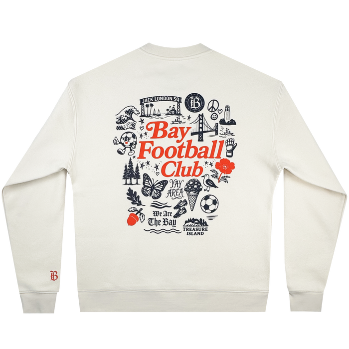 The Bay FC Jubilee Crew is a white men’s crewneck sweatshirt featuring an orange "Bay Football Club" graphic with black bridge, tree, bear, and soccer ball illustrations on the back plus a small orange "B" logo on the left wrist. Brand: Bay FC.