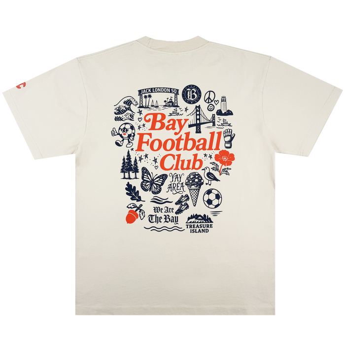 The Bay FC Jubilee Tee is a cream classic-fit t-shirt with “Bay Football Club” in bold red and navy Bay Area icons on the back, plus “We Are The Bay.” Made from heavy-weight cotton—perfect for any Bay FC fan.