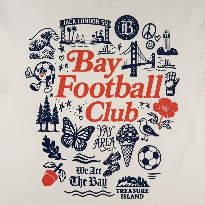 The Bay FC Jubilee Tee by Bay FC features iconic Bay Area graphics—Golden Gate Bridge, waves, Alcatraz, soccer ball character, trees, butterfly, acorn, and Bay FC text—on a classic fit premium heavy-weight cotton t-shirt.