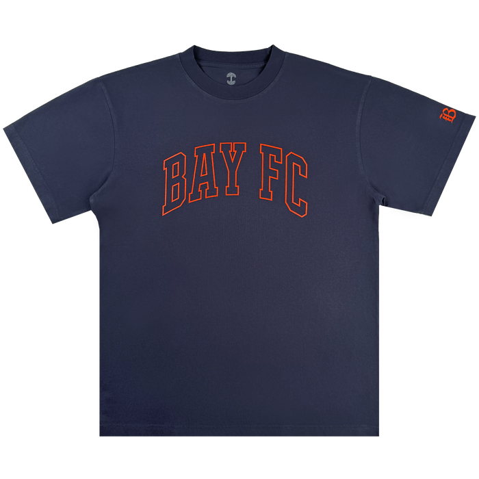 The Bay FC Varsity Tee is a classic fit, heavy-weight cotton navy shirt with bold orange "BAY FC" text on the chest and a small orange "B" logo on the left sleeve, shown flat on a white background.