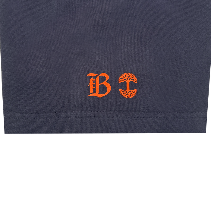 The Bay FC Varsity Tee is a navy blue, heavy-weight cotton classic fit t-shirt featuring two orange symbols—a Gothic "B" and a circular, tree-like "C"—by Bay FC’s iconic emblems.