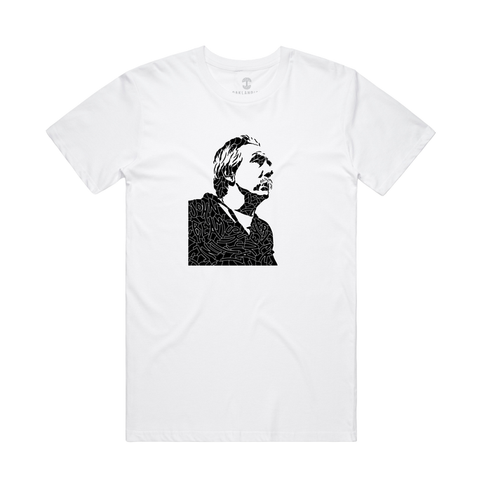 The Oaklandish Coach Beam's Legacy Tee is a white shirt featuring a black, abstract line art portrait of Coach John Beam with medium-length hair and a mustache, centered on the chest to honor Oakland youth. Background is plain.