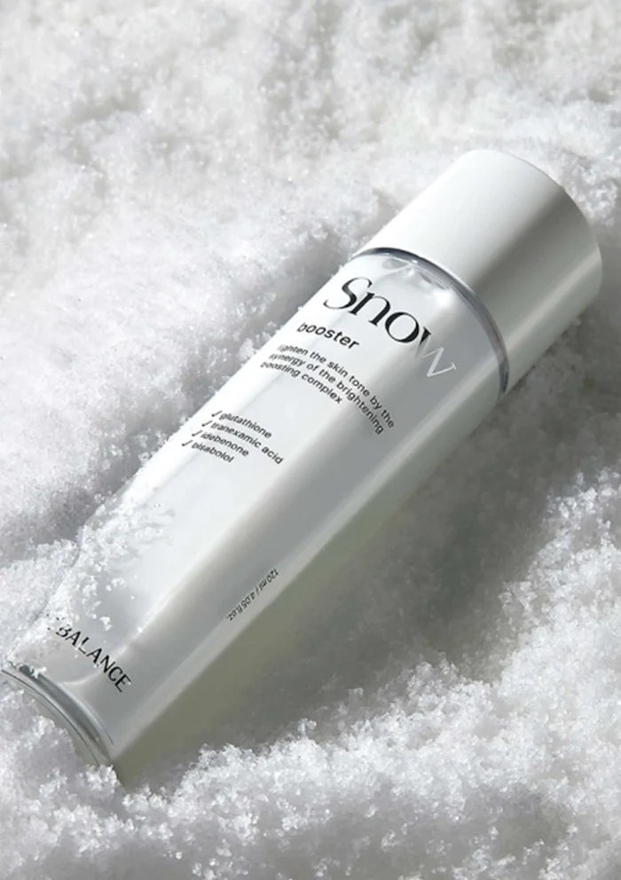 Skincare bottle labeled 'Snow' on a textured white background