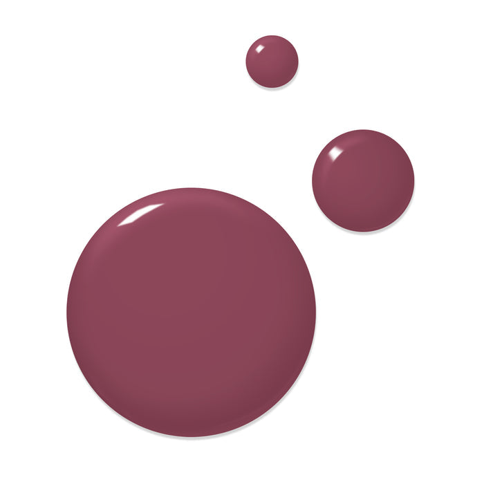 Three drops of LONDONTOWN's Best Year Ever, a glossy, brownish-purple liquid of varying sizes, rest on a white background, like a captivating berry dream.