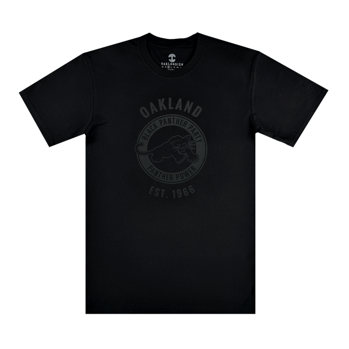 The Oaklandish Black Panther Power Tee is a black shirt with a dark gray crouching panther and circular text: "OAKLAND," "BLACK PANTHER PARTY," "PANTHER POWER," and "EST. 1966"—a tribute to social consciousness.