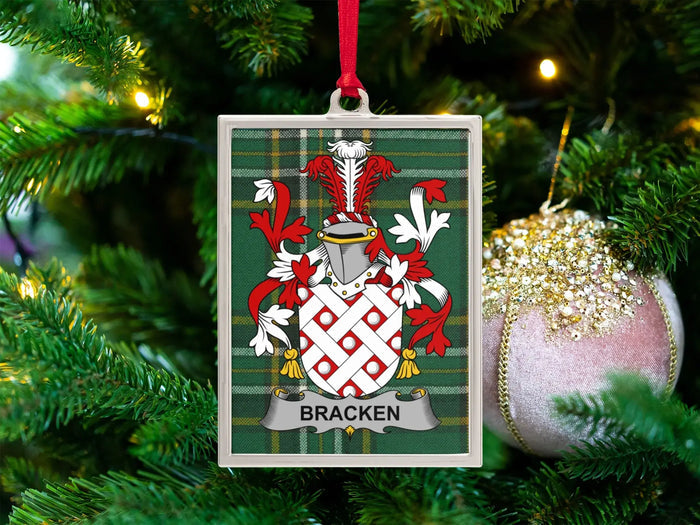 Bracken Irish family crest Christmas ornament — crest on the Irish national tartan in a silver-tone frame