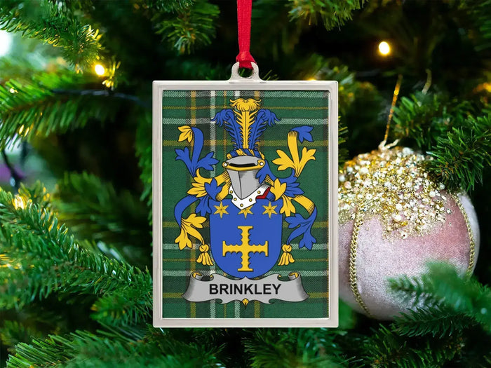 Brinkley Irish family crest Christmas ornament — crest on the Irish national tartan in a silver-tone frame