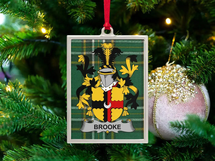 Brooke Irish family crest Christmas ornament — crest on the Irish national tartan in a silver-tone frame