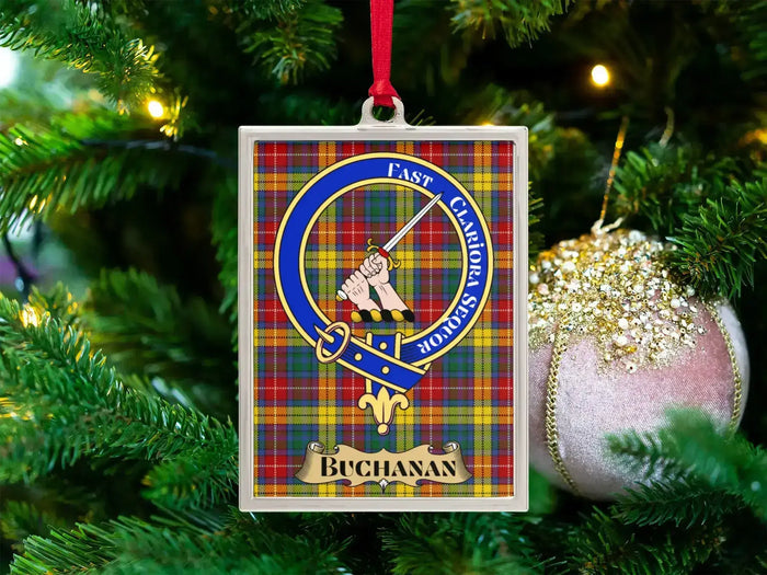 Buchanan clan crest Christmas ornament in a silver frame on a tartan background