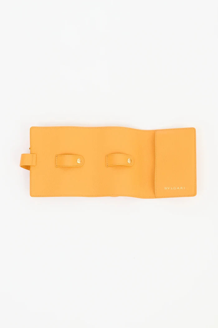 Yellow Bvlgari leather travel watch case with sleek design, new in box, for protecting and organizing luxury watches.