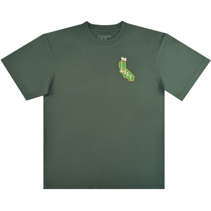The CA Bay Area Tee By DOC by Oaklandish is a green heavyweight cotton classic fit t-shirt with a small yellow and white California waving flag "BAY" graphic on the left chest. Part of The Bay Collection. Plain white background.