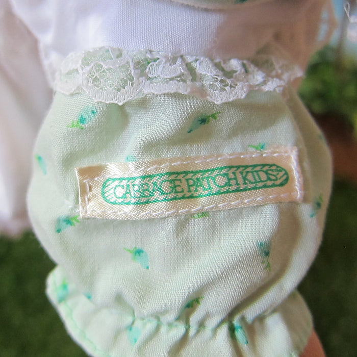 Cabbage Patch Kids silk tag on green rosebud dress