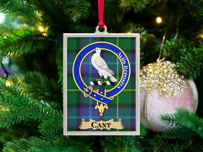 Cant clan crest Christmas ornament in a silver frame on a tartan background