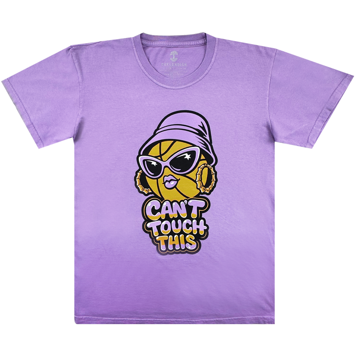 The Can't Touch This Tee by GSV features a lavender, 100% cotton classic fit with a cartoon basketball in sunglasses, hoop earrings, and a purple bucket hat. Centered below is bold yellow, white, and black "CAN'T TOUCH THIS" text.
