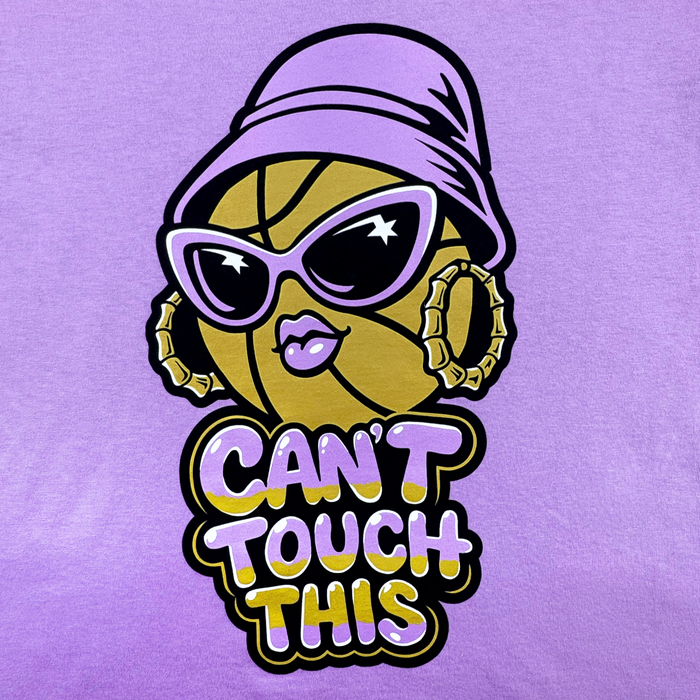A playful, confident GSV Can't Touch This Tee features a cartoon basketball with hoop earrings, sunglasses, pink lips, and a purple hat above bold "CAN'T TOUCH THIS" text on a purple background in a classic fit.