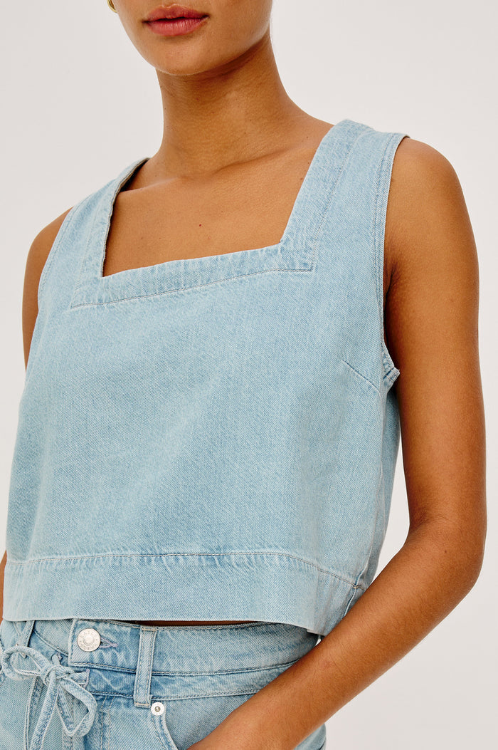 Carbon Crop Tank Top in Cotton Lyocell Denim With Square Neckline, Wide Shoulder Straps, and a Loose, Boxy Fit in Surf Colorway - Upper Body Front View Featured on Model