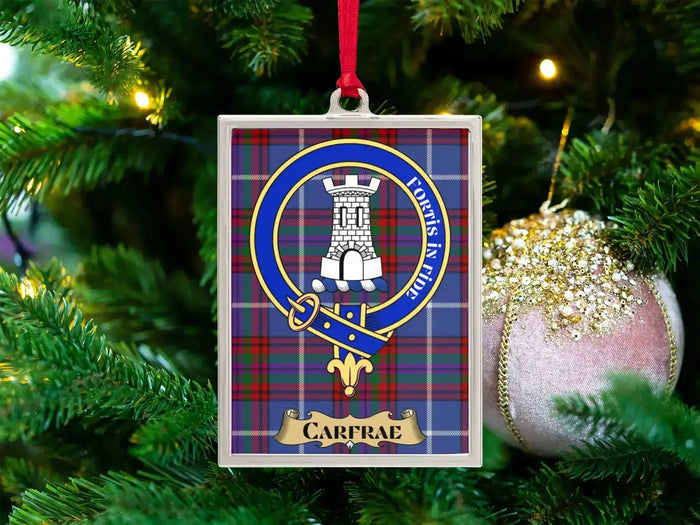 Carfrae clan crest Christmas ornament in a silver frame on a tartan background