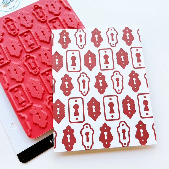 Catherine Pooler - Background Stamp - Lots of Locks. Create a vintage lock background with the Lots of Locks Background Stamp! This repeating pattern will make a great layer for your card inked up in a variety of colors. Available at Embellish Away located in Bowmanville Ontario Canada.