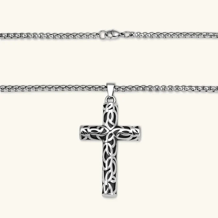 Celtic Cross Necklace with a polished silver-tone stainless steel pendant, dark accents and intricate interlaced filigree